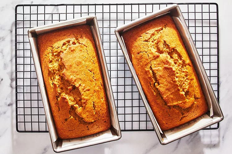 Bake until the top has browned and a toothpick inserted into the center comes out clean, about 53-58 minutes. Allow to cool completely in pan before removing and slicing.