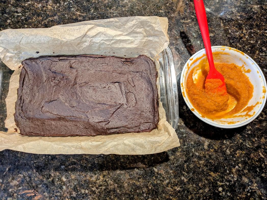 In a small bowl, mix together the remaining pumpkin puree with granulated monk fruit and vanilla extract. Spread on top of the cooled brownies