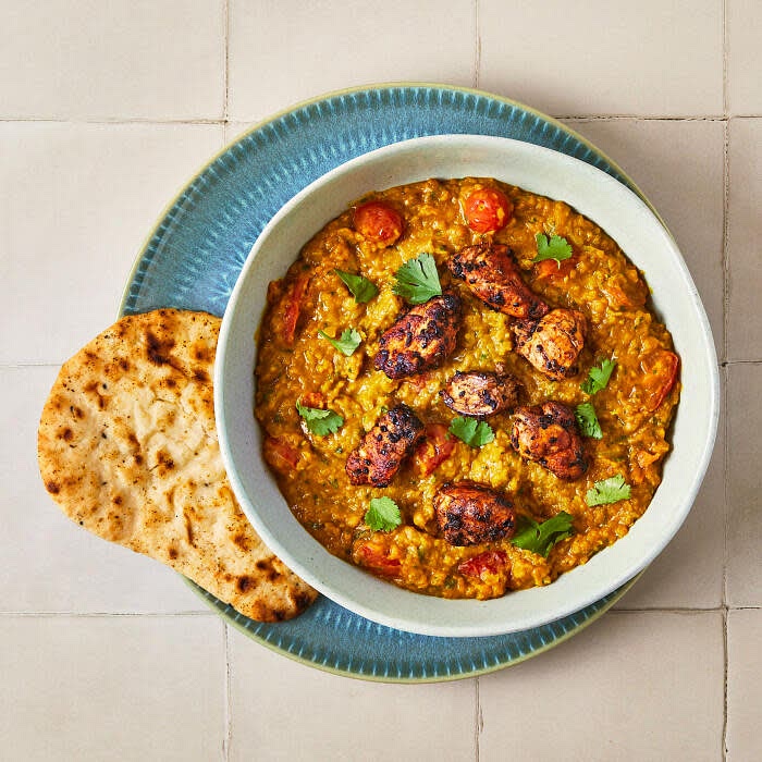 Serve the paprika chicken over the tomato & coconut dal with a warmed naan to the side
Garnish with the remaining chopped coriander