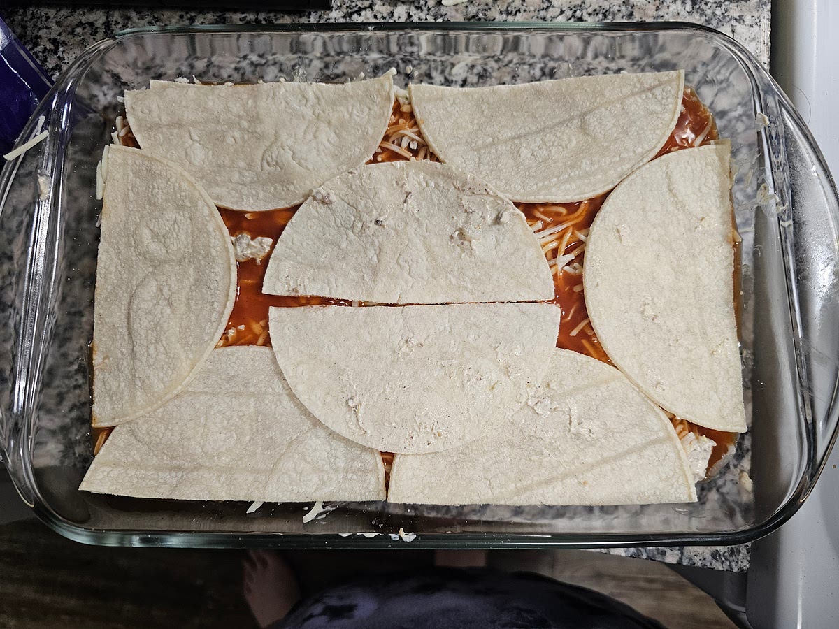 Repeat steps 7-10, layering tortillas, mix, cheese, sauce