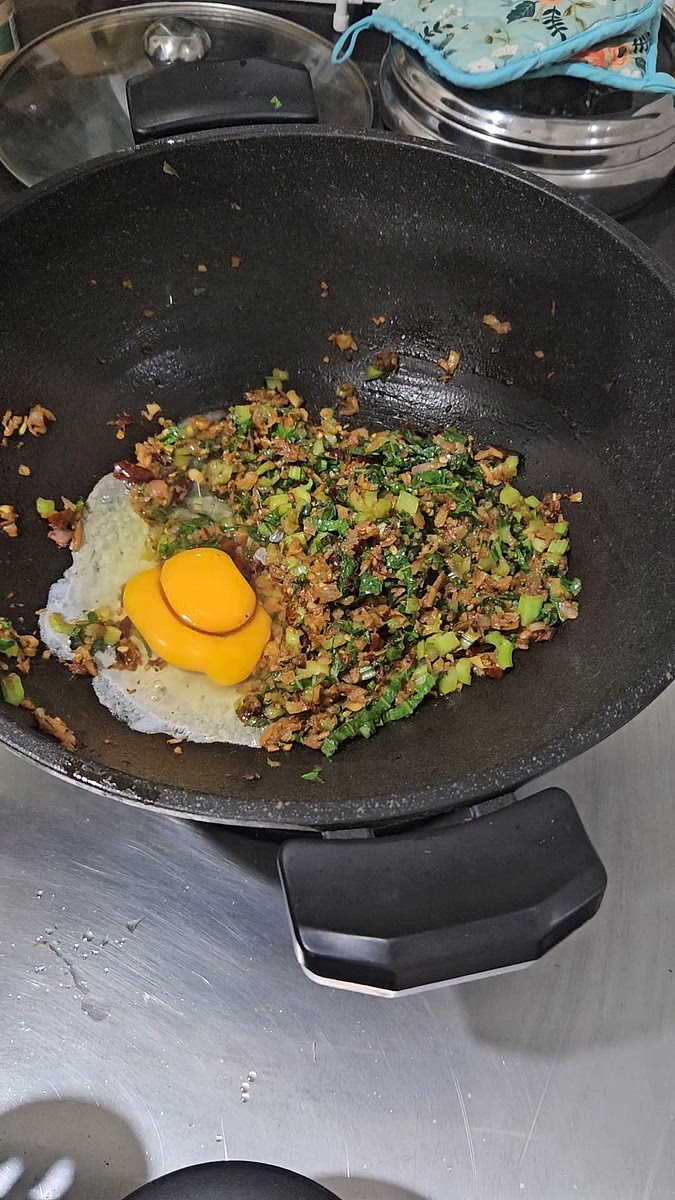 Add in egg and fry gently