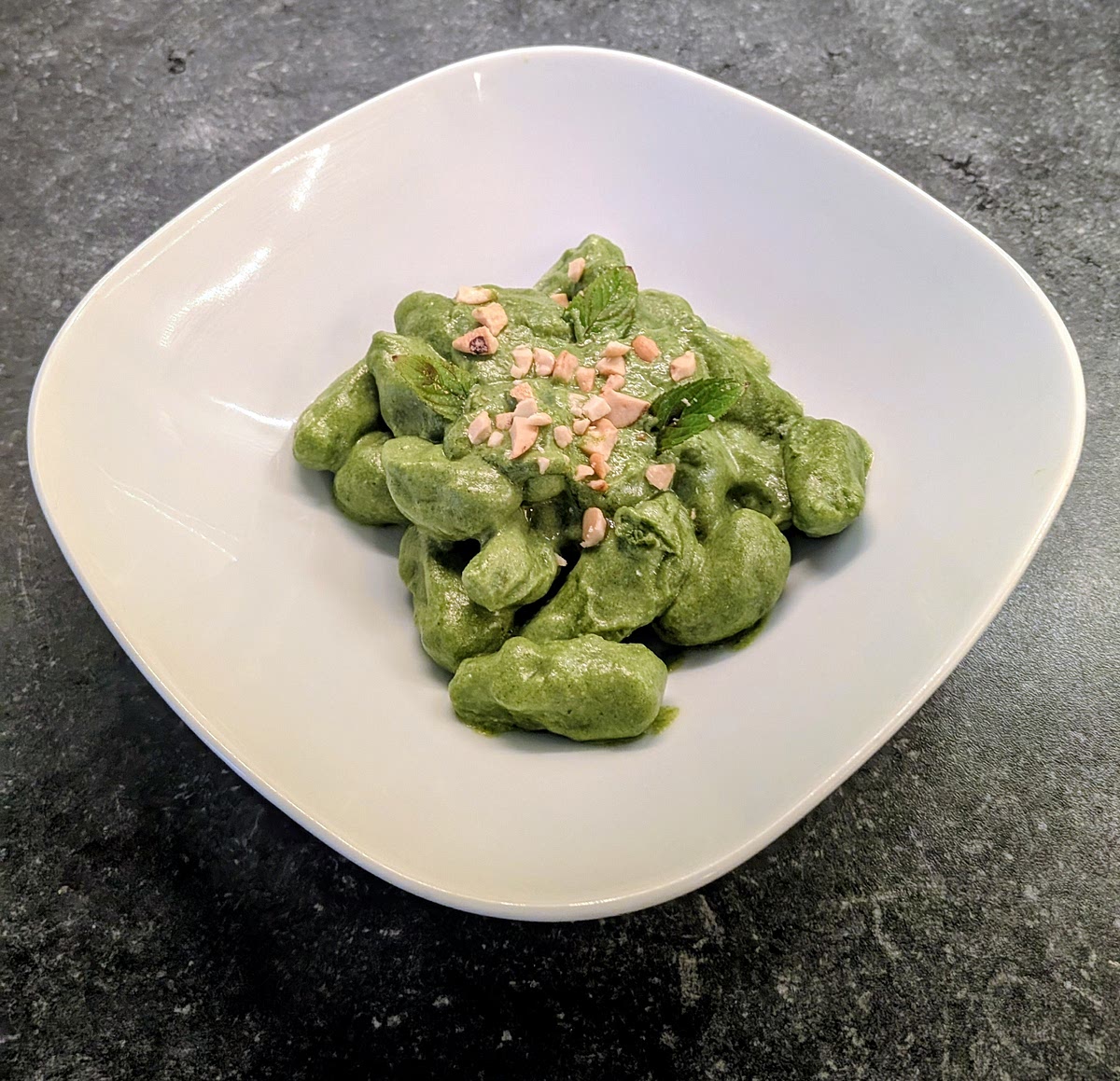 Plate them, top them with the chopped nuts and mint leaves, and serve right away.