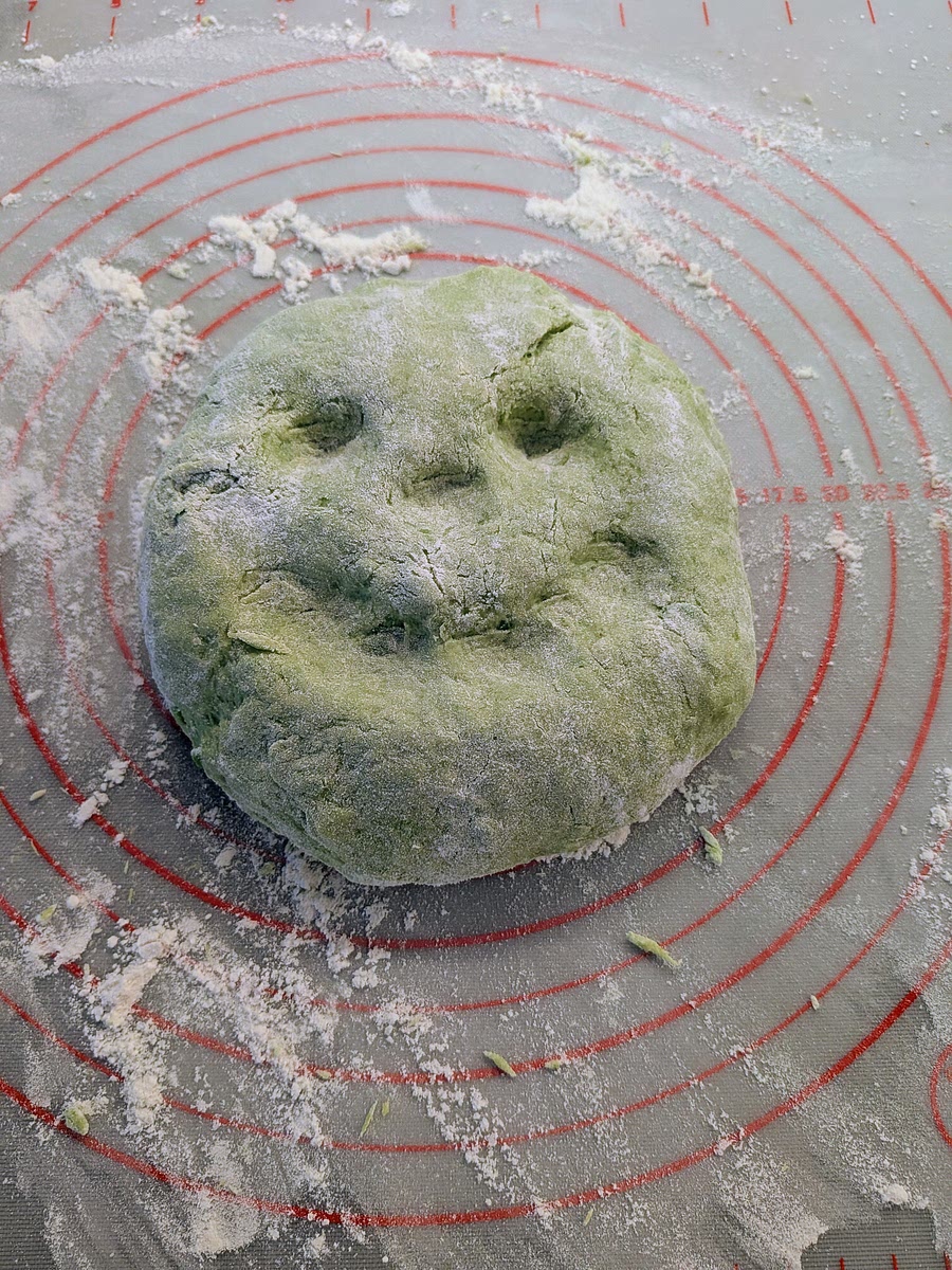 Drop the contents of the bowl onto a lightly floured surface and fully integrate it into a dough.