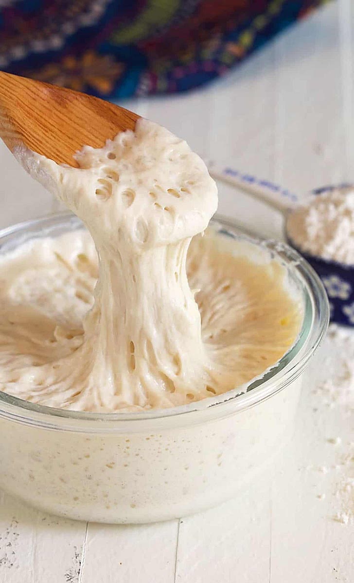 Instructions for Mumbai, keep the temperature in mind, keep the starter where a fan or in a cool place to achieve the max 27 degree C
Mix the flour, sugar, and yeast together in a clean and sterile container (use only glass, glazed ceramic or crockery to hold your starter. No metal or plastic) that can hold two quarts.