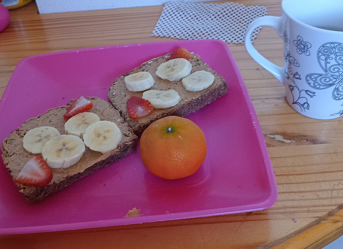 One:get peanut butter with no add sugar and salt two:get banana and strawberries three:use toaster to toast the brown bread four: cut the banana and strawberries and have it with green tea