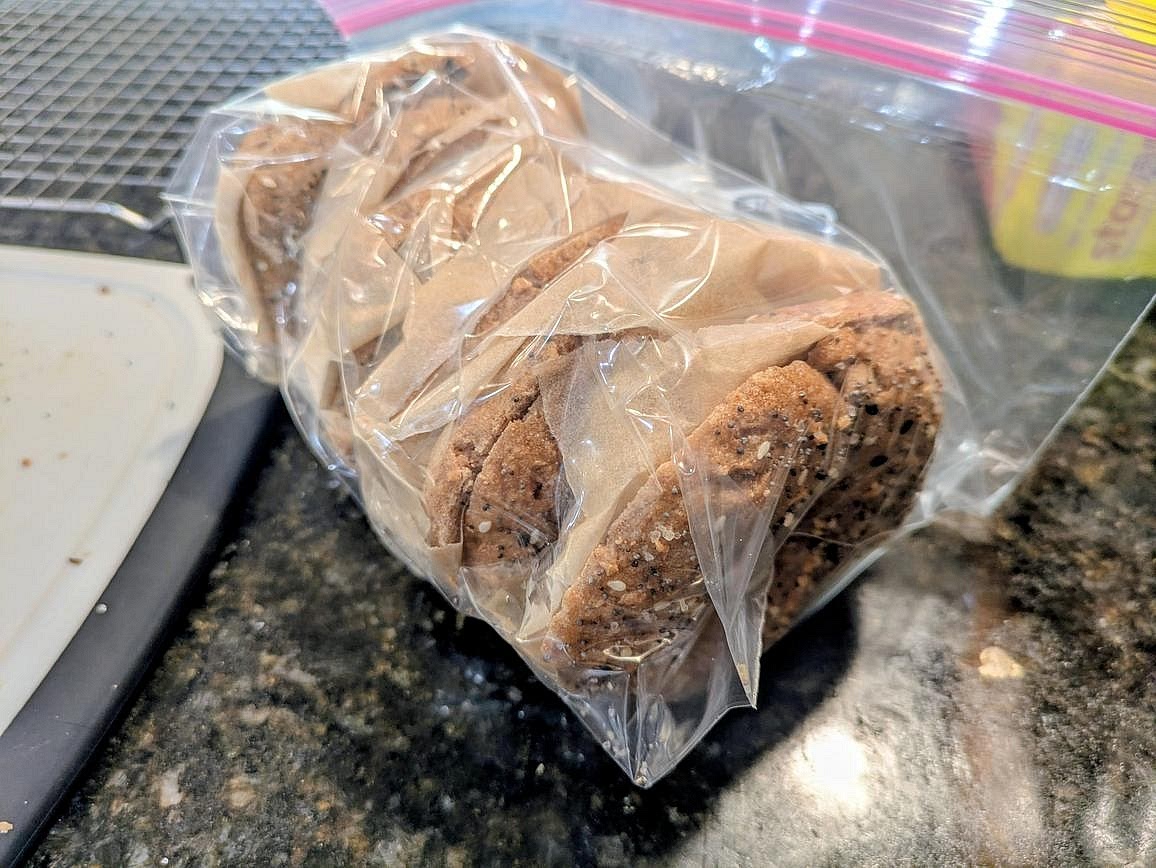 Add each bagel to a large airtight bag, with a piece of parchment paper in between each bagel. Store the bag of bagels in the freezer