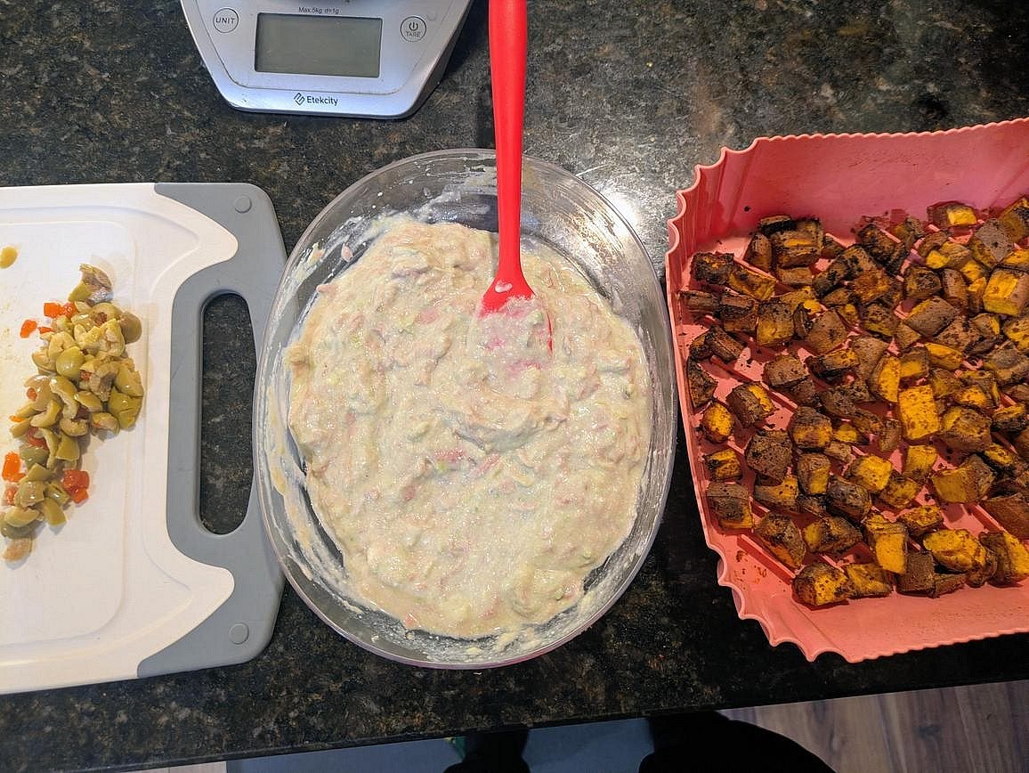 Add your roasted sweet potatoes to one side of a bowl, and add your tuna mix to the other. Top with chopped olives