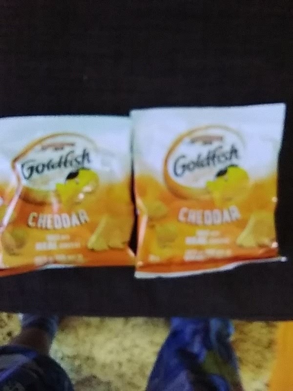 Get 2 packs of goldfish to put in the bowl.