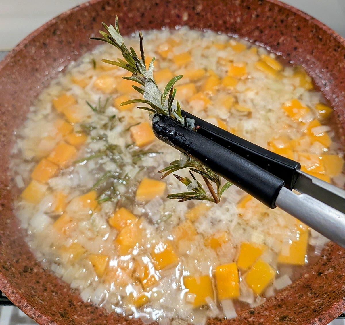 Once the squash has softened, pick out and bin the rosemary sprigs.
