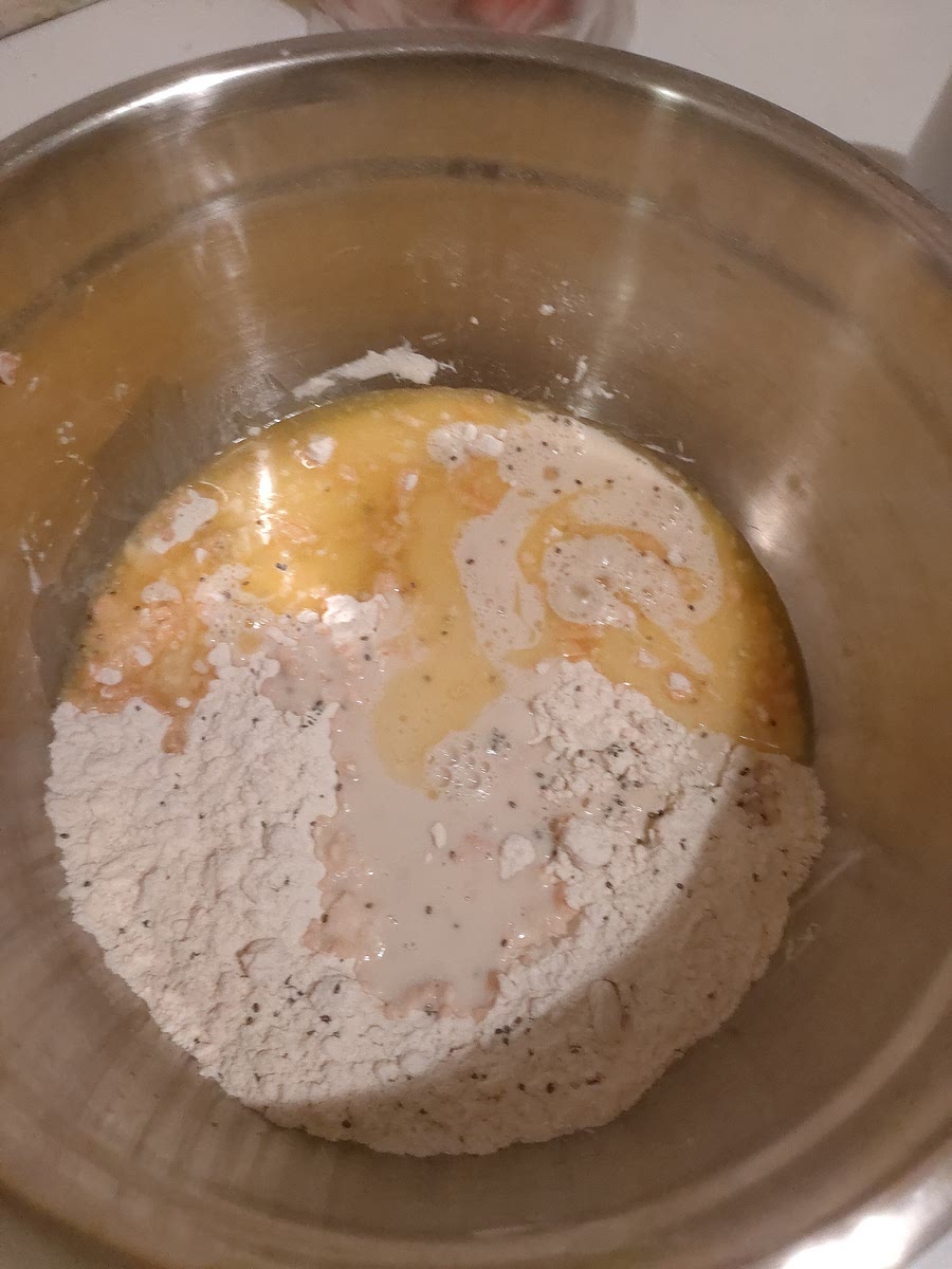 Add milk and melted butters and syrup, then mix