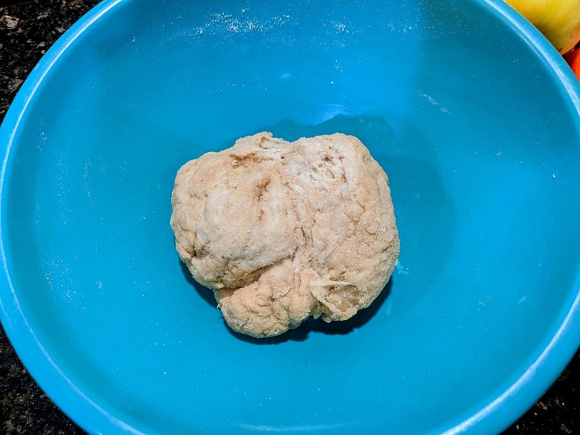 Add in the vinegar and water, and bring together with a dough scraper. Let the dough rest for 5 minutes
