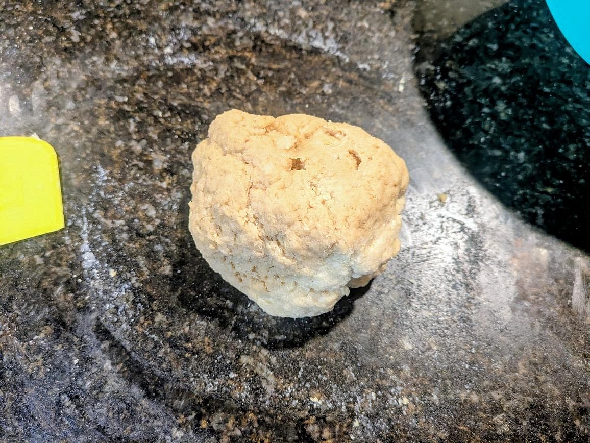 Turn the dough onto a clean counter, and knead for about 10 minutes, until you have smooth and cohesive bread dough that's stretchy and doesn't tear