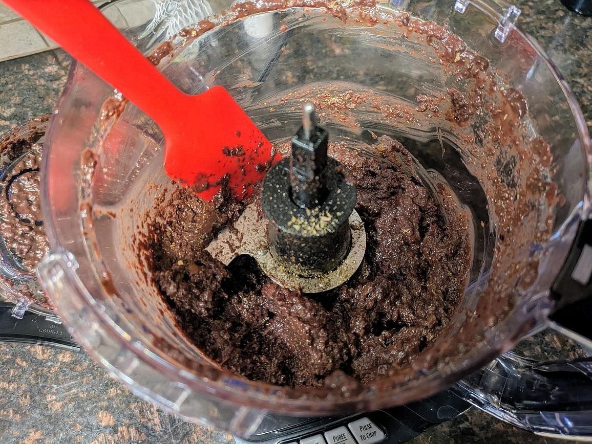 Drain and rinse your olives. Add all ingredients to a food processor, and blend until smooth. Season with salt to taste (will depend on your olives), and store in the fridge