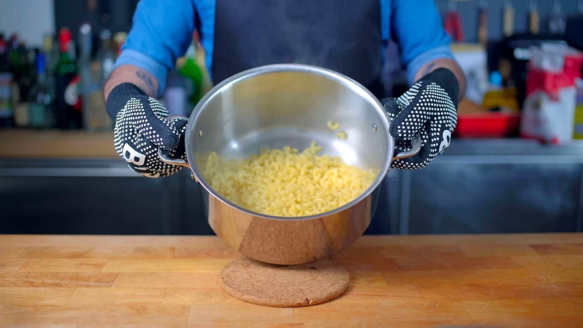 Begin by cooking macaroni in water