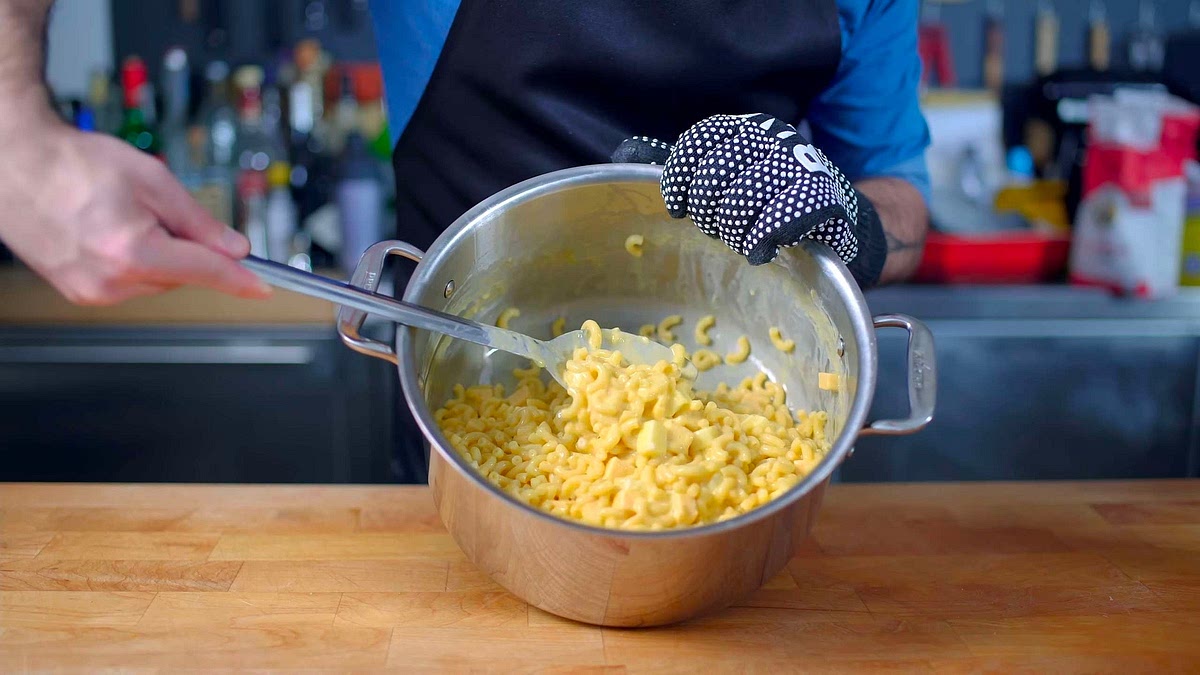 After the cheese has melted and the pasta is creamy and cheesy, add the smoked gouda and mozzarella then mix until evenly distributed