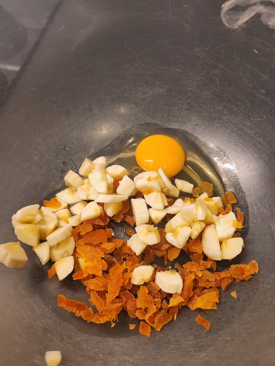 Chop the dried fruit (dates or peaches) in small fine pieces then beat the egg with them and the banana.