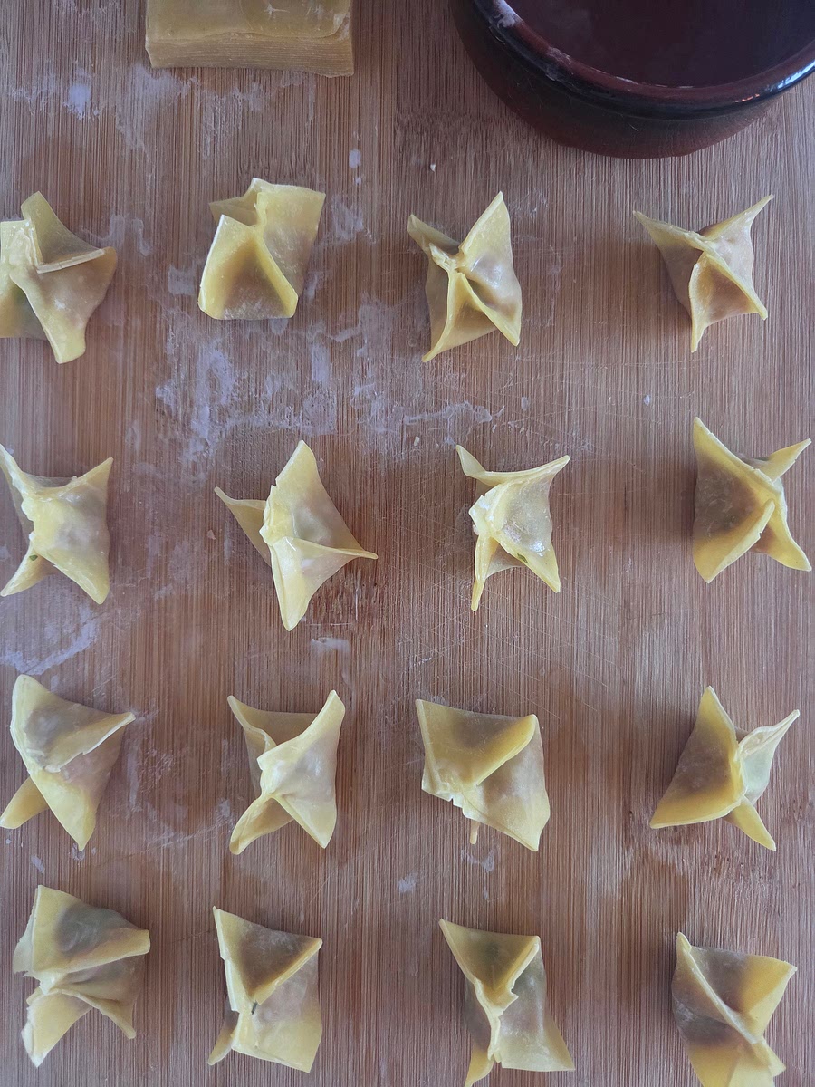 Fold the pastry by wetting the edges and bringing the opposite ends to the middle.