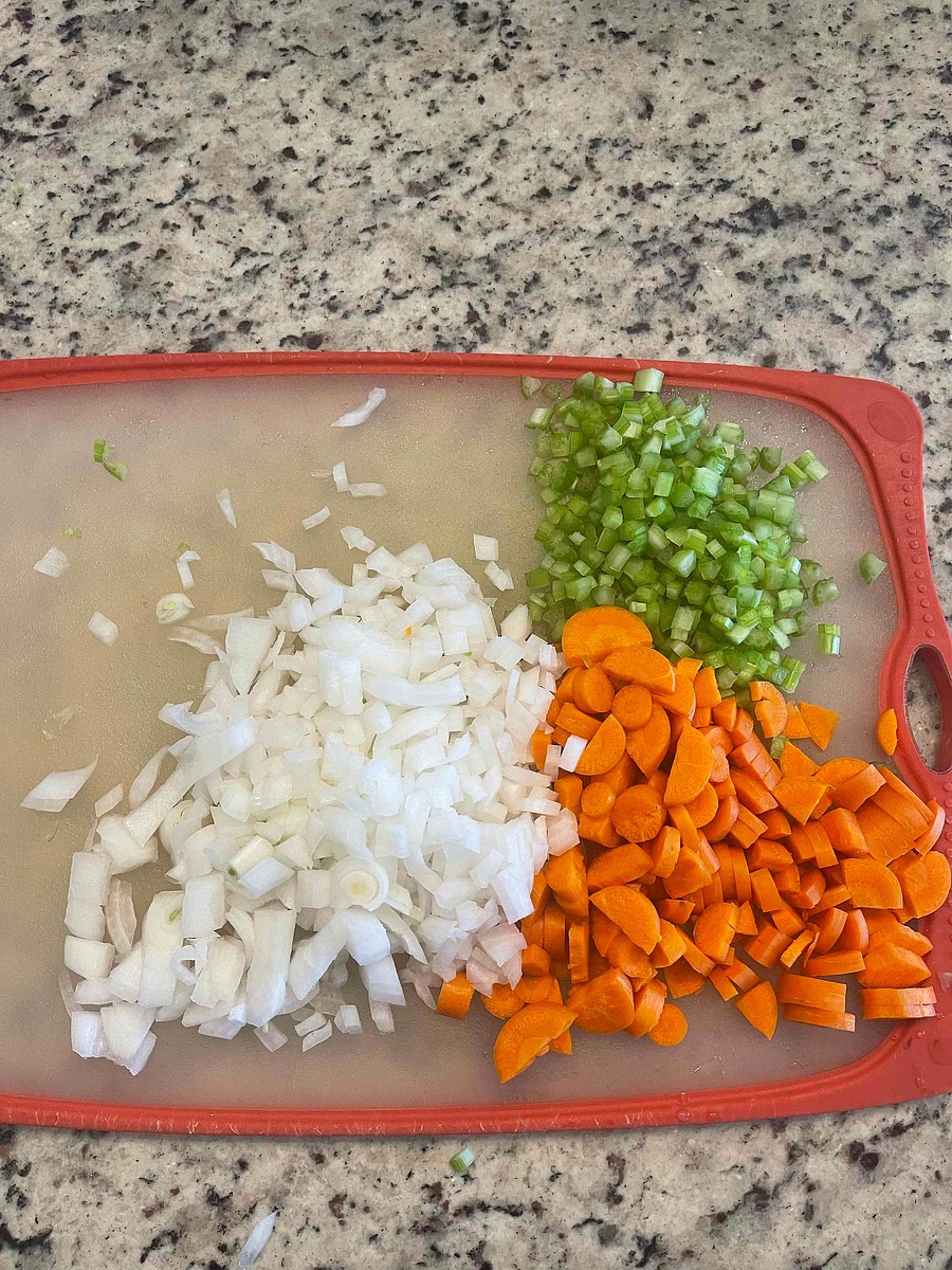 Finely dice the Celery Stalks, Carrots, and White Onion.