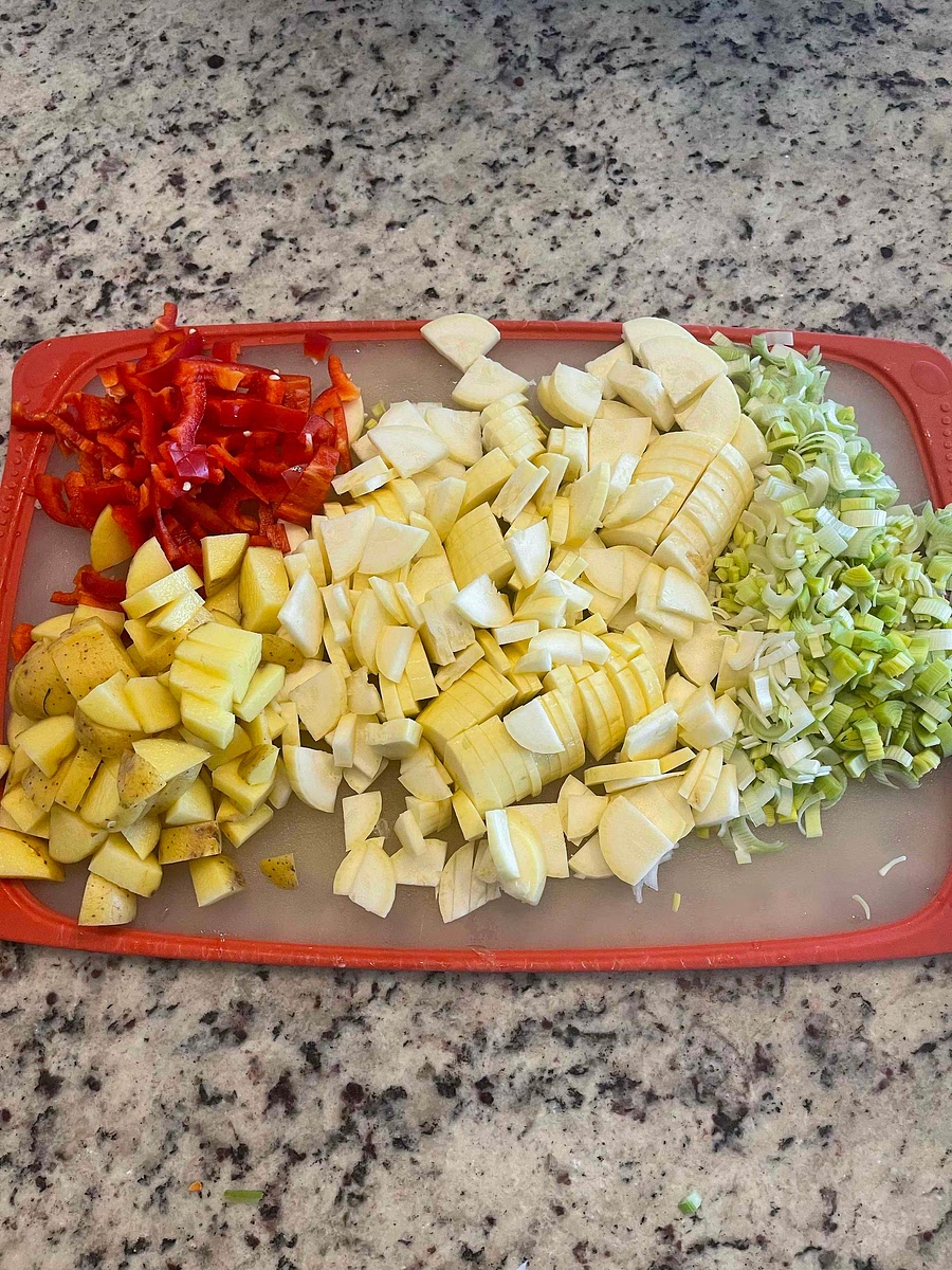 Rough chop the Bell Pepper (seeds removed), Squash, Potatoes, and Leeks (without the green). You can use ANY vegetables you want. These are what I used.