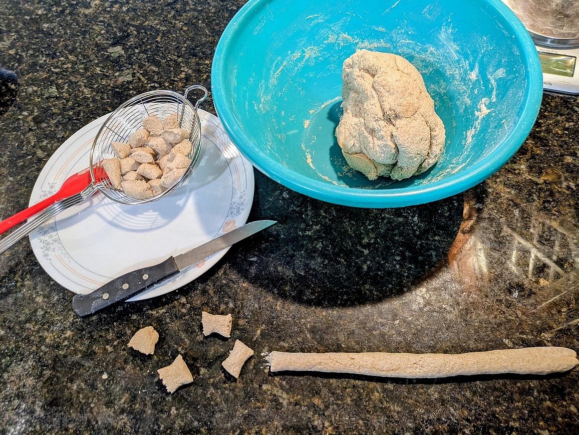 Turn the dough onto a clean work surface. In batches, roll into a long and thin rope, and cut into 1" sized pieces