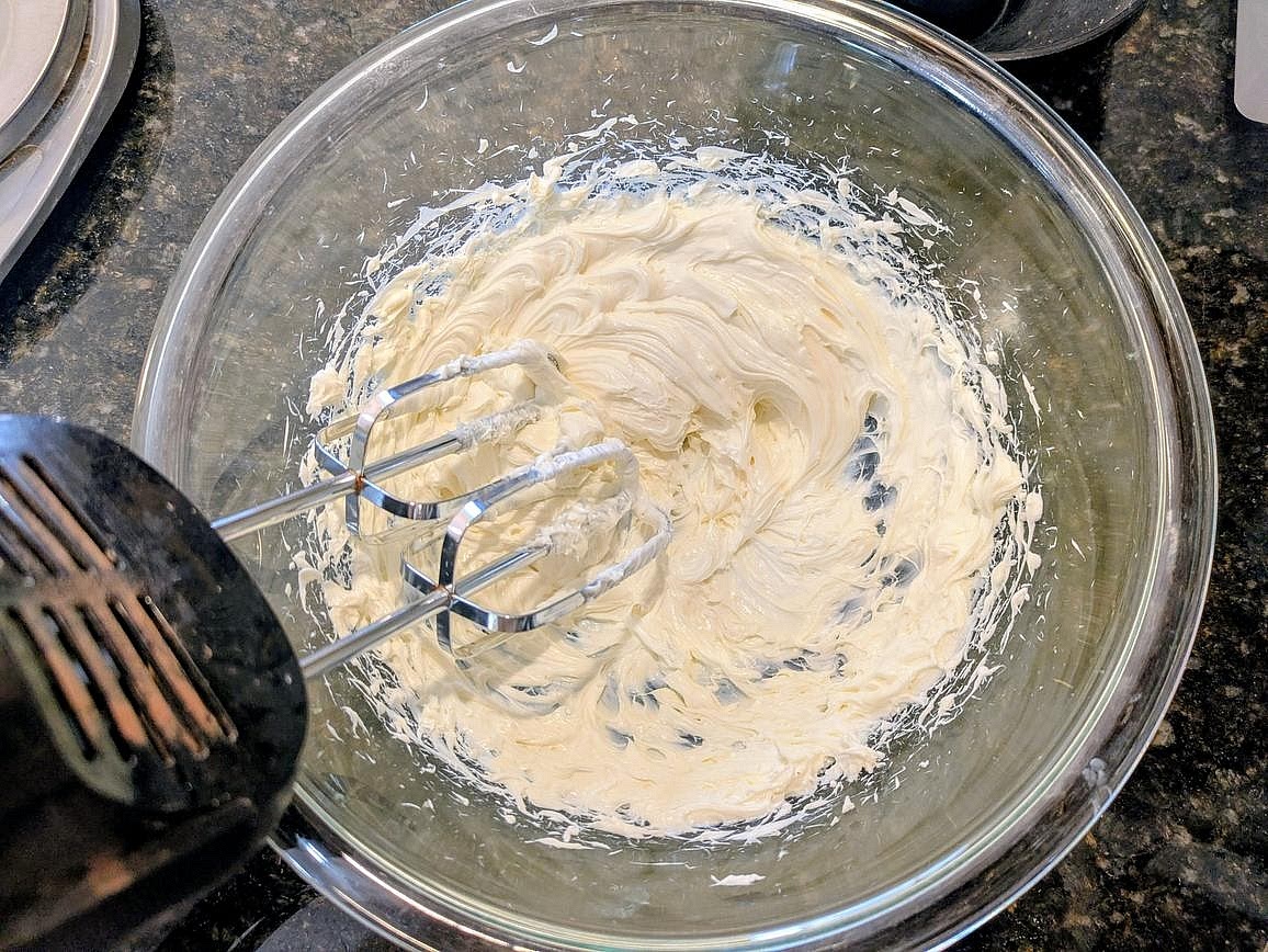 In a large bowl with a hand mixer, beat your softened cream cheese until light and fluffy, about 3 minutes