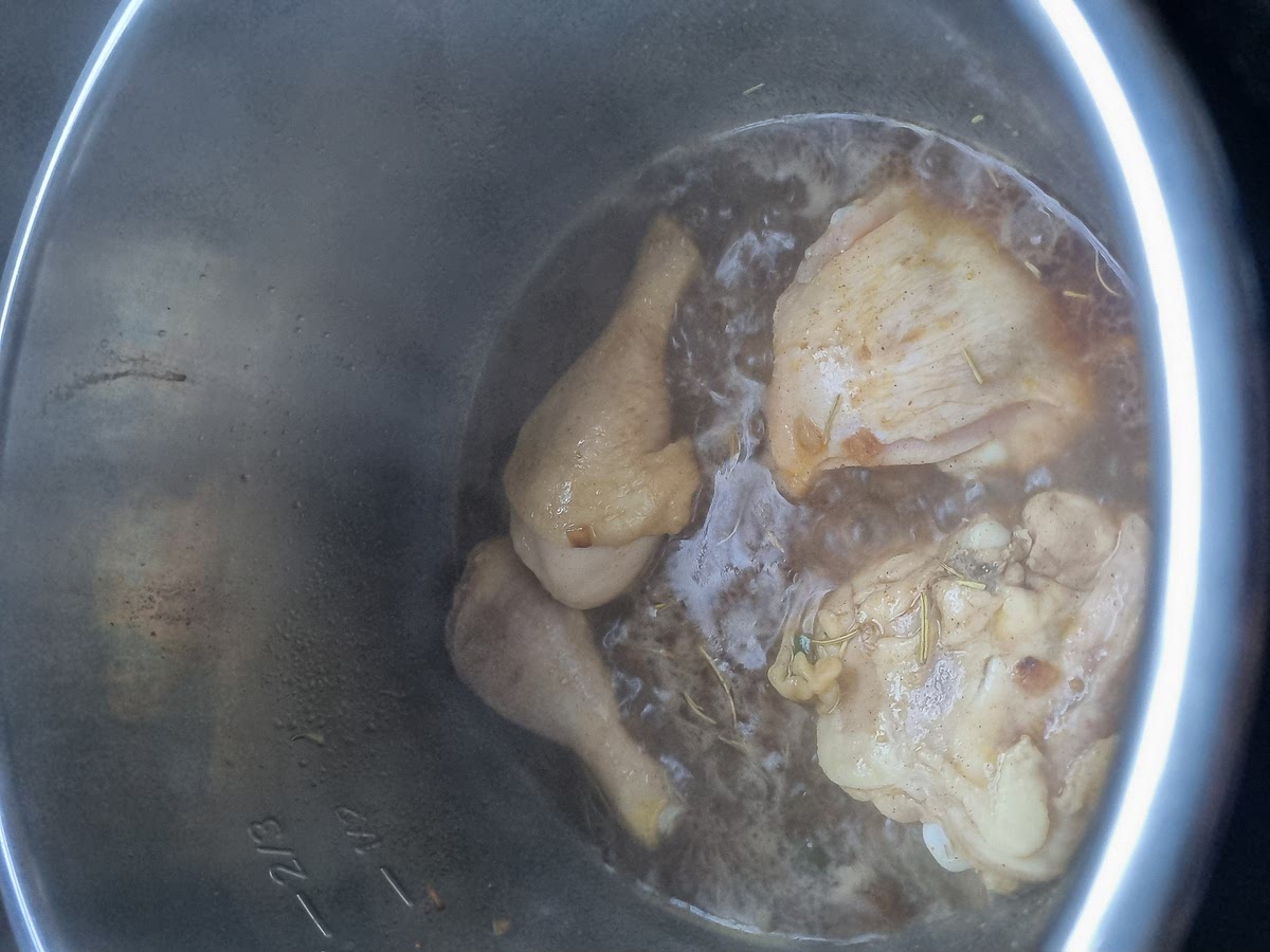 Fry the chicken then add some water and chicken stock and pressure cook for 5 minutes