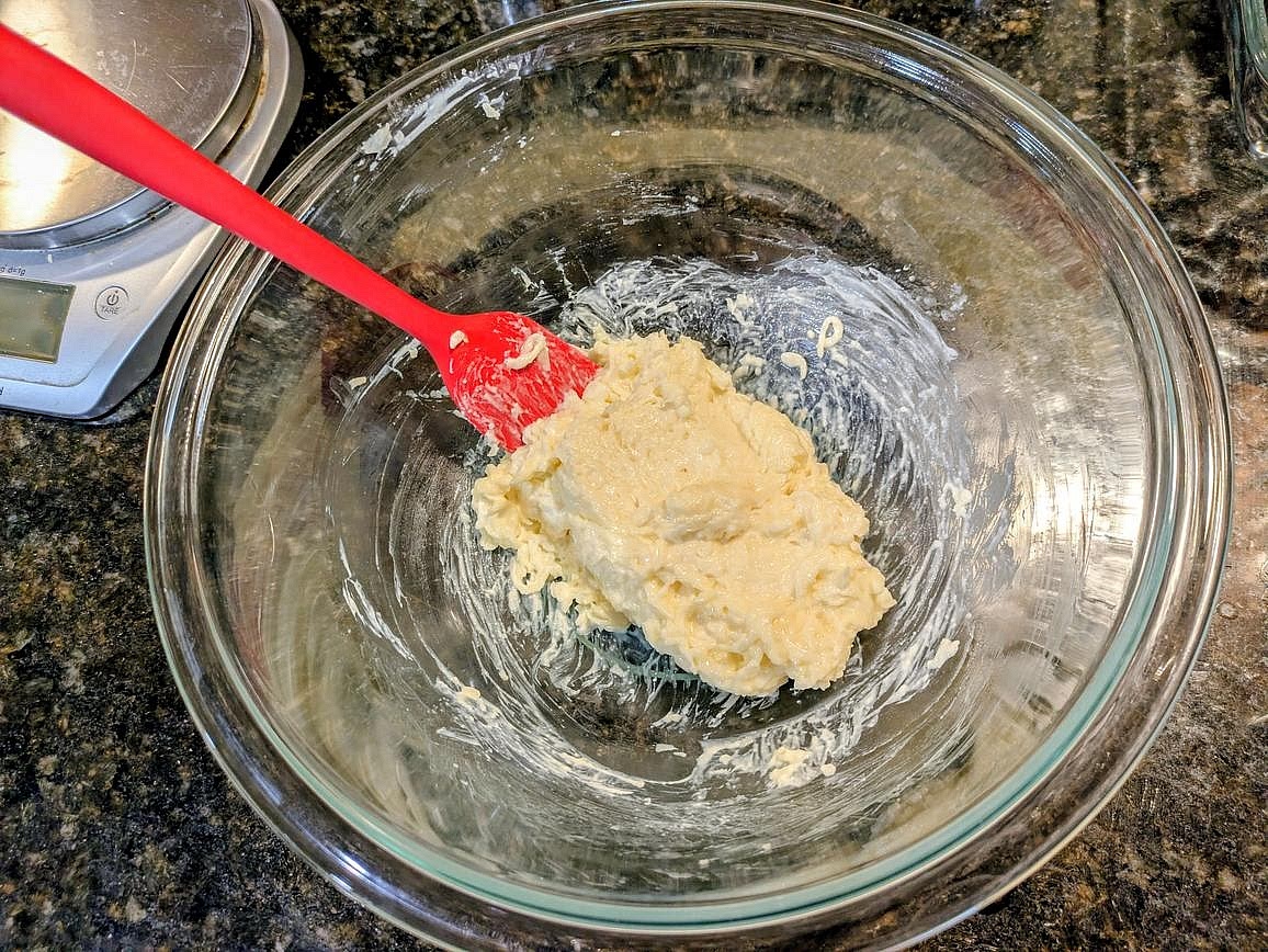 Add the mozzarella to a large glass bowl. Cut the cream cheese into cubes, and add on top. Microwave for 1 minute, stirring halfway with a silicone spatula