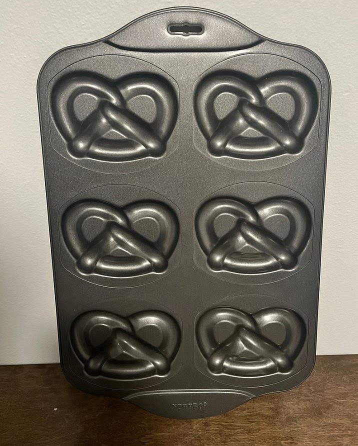 Preheat your oven to 350F. Line a large cookie sheet with parchment paper. Alternatively, you can use a pretzel pan like this one below for easier shaping. In this case, lightly grease the pan with oil