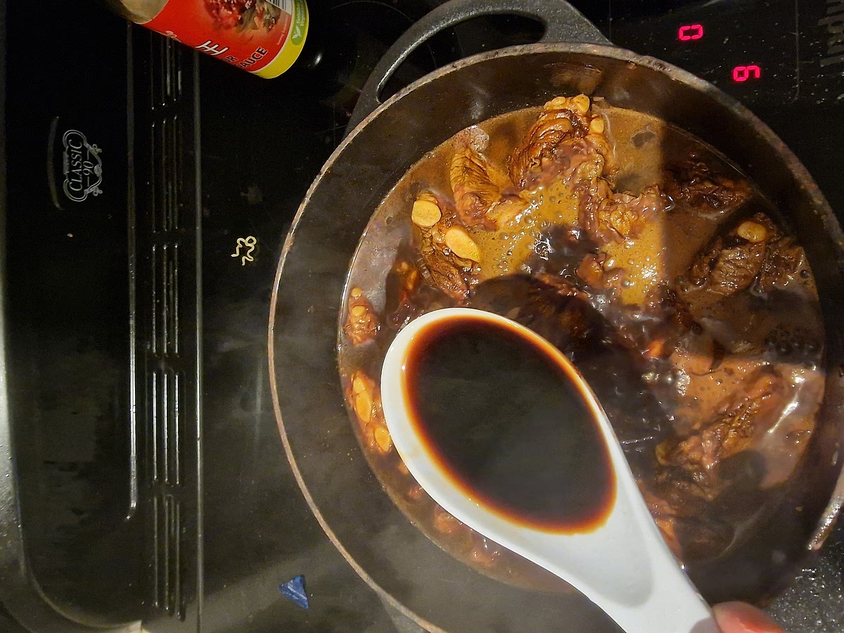 Add light soy sauce and enough boiling water to cover if you press the ribs down and bring back to the boil.