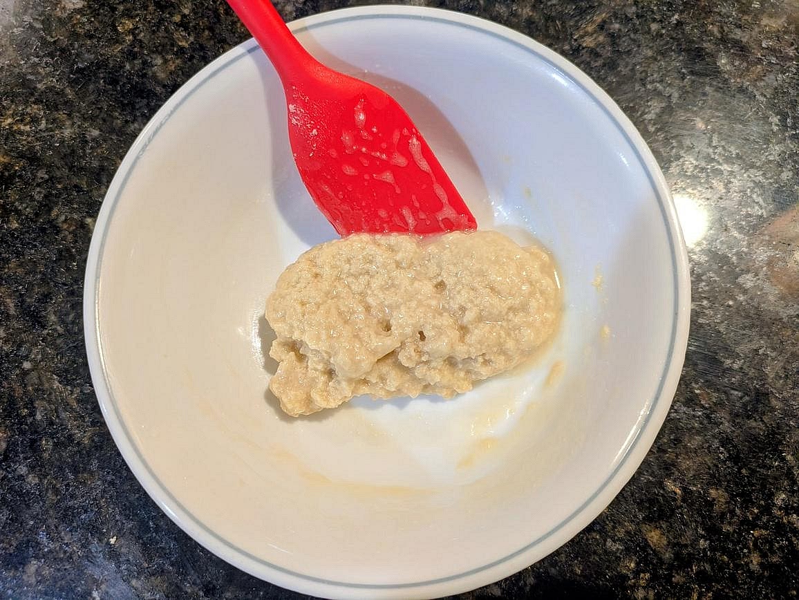 Mix in the protein powder, monk fruit, inulin, baking powder, salt, vanilla extract, and almond milk with a silicone spatula