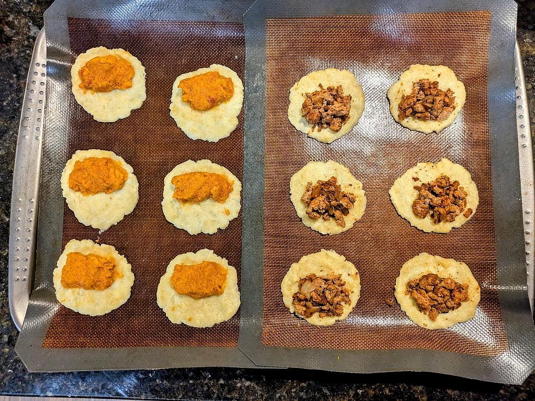 Add filling to the bottom half of the dough circle, leaving a 1/2" border