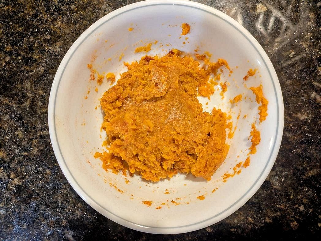 To make a sweet potato pierogi instead, preheat your air fryer to 400F. Wash 2 medium (400 g) sweet potatoes, and prick with a fork. Wrap in foil, and air fry for 1 hour (or bake in a 400F oven for 1.5 hours), or until fork tender. Add your roasted potato to a medium bowl, and season with 1 tsp (3 g) each of garlic powder, onion powder, paprika, and cumin, as well as 1/2 tsp (3 g) salt. Each pierogi gets about 1.5 tbsp (23 g) of filling