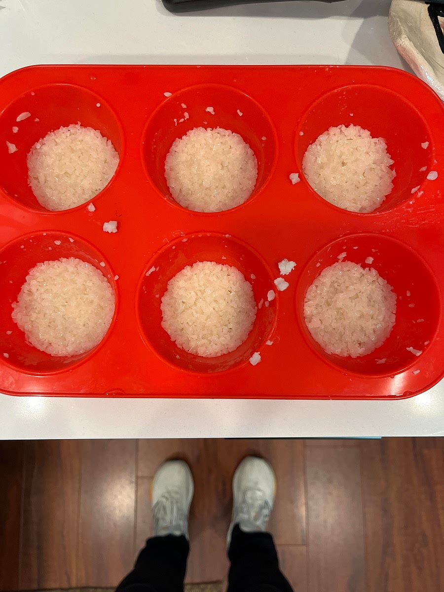 Transfer from pan to greased (or lined with parchment) square or 9x13 Pyrex (based upon how thick you want your rice squares to be). Press into pan and freeze. ALTERNATIVE: Press into greased muffin tins at desired thickness. Use large muffin pan for main dish (make 5-6 rice disks per serving) and small muffin pan for bite sized appetizers.