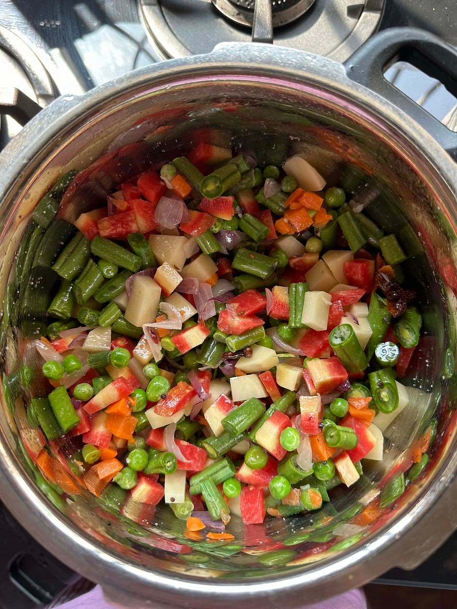 After onion turns translucent, add all the chopped veggies.