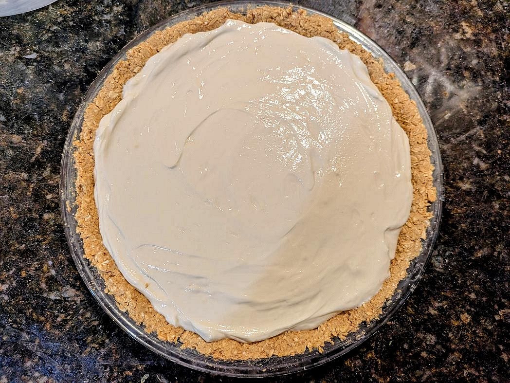 Add your yogurt into the pie crust, and smooth out the top