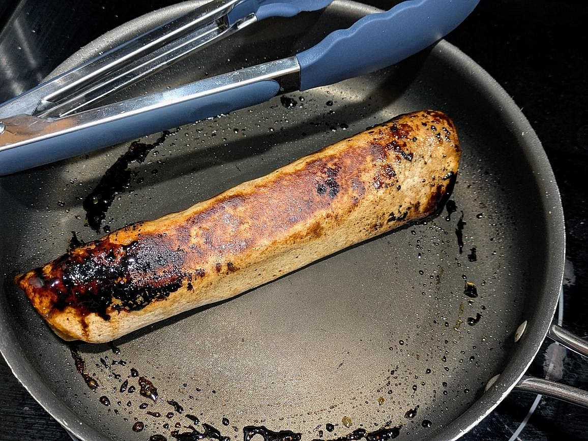 Add the tortilla cut side down to the hot pan, and let sit for at least a minute to seal it shut. Brown all 4 sides, and remove from the heat. Sprinkle cinnamon on top, cut in half, and serve