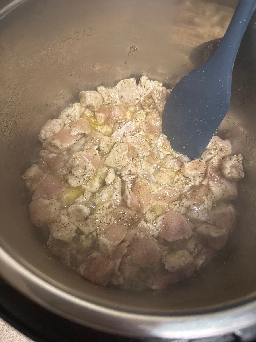 Add the olive oil to instant pot on sauté mode (normal or high) Once hot, add the cubed chicken. Season with salt, pepper, garlic, and Italian seasoning. Cook for 3-4 minutes, stirring occasionally, until the chicken is browned on the outside. (It does not need to be cooked all the way through).