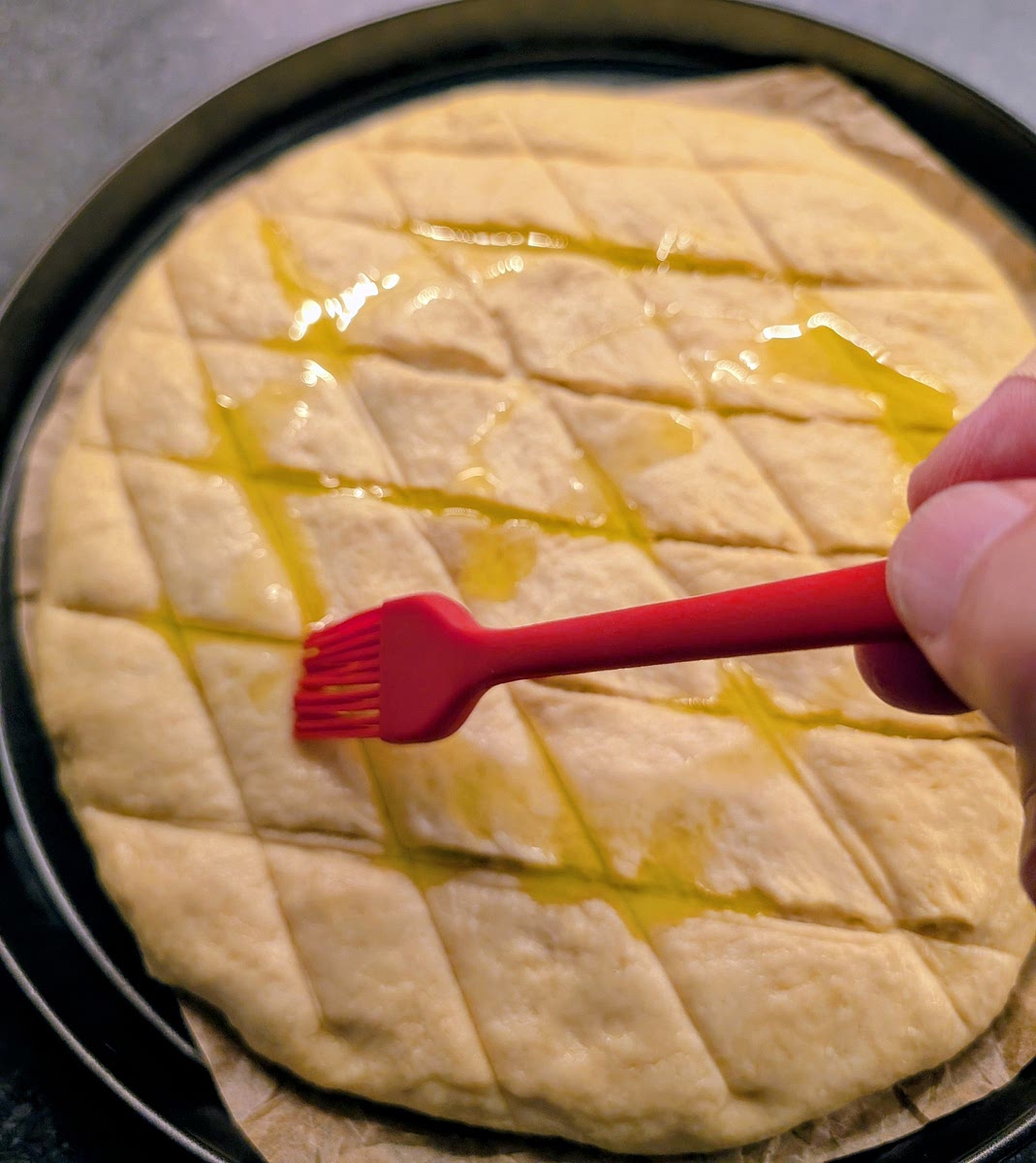 Paint the surface with the extra virgin olive oil