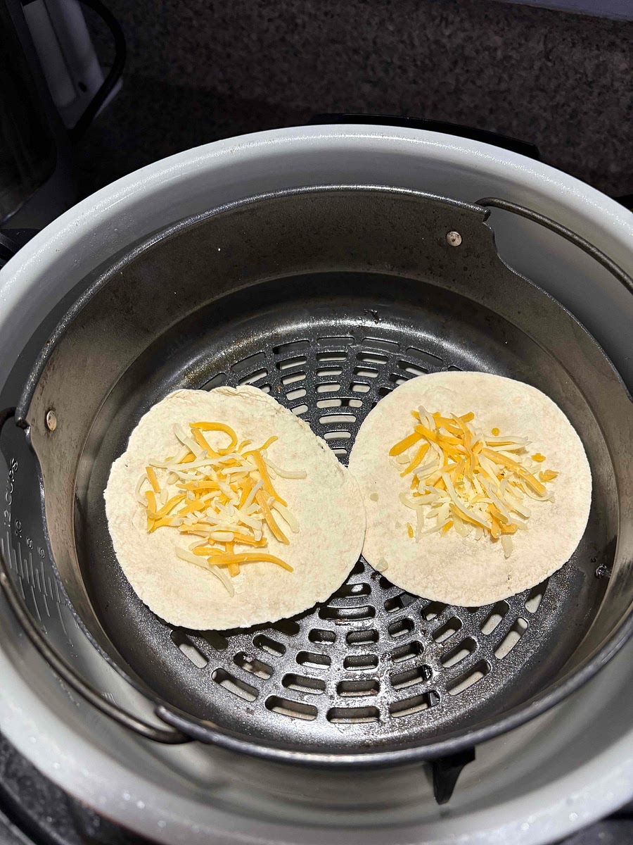 Bake or air fry low-carb tortilla with cheese on it until slightly browned and cheese melts 3 to 5 minutes