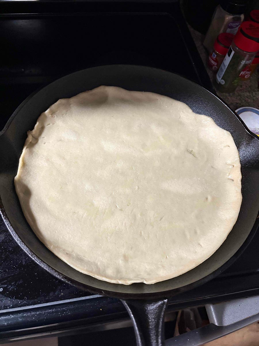 Place the bottom crust in a greased pan then pre cook the bottom crust in the pan for five minutes at 375°