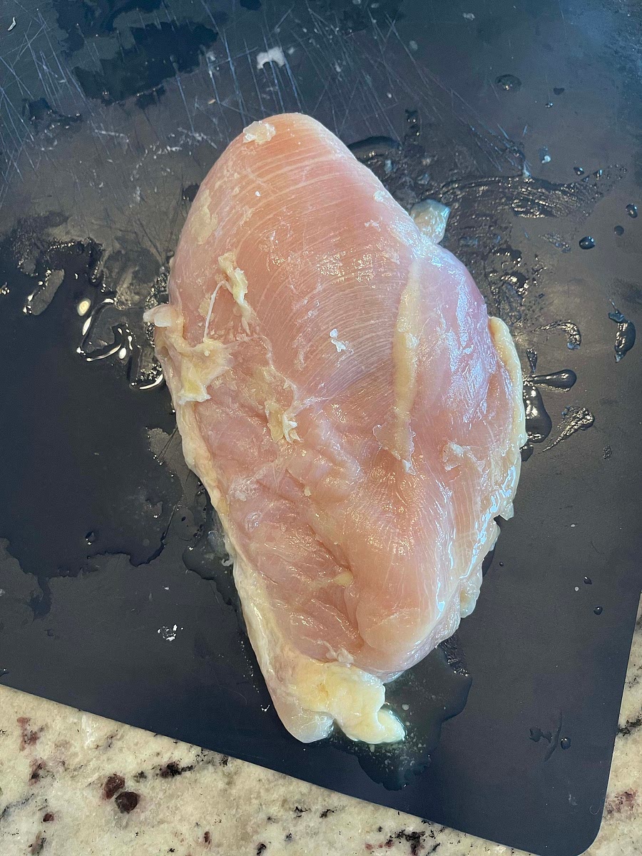 Brush both sides of the chicken with melted butter, or olive oil.