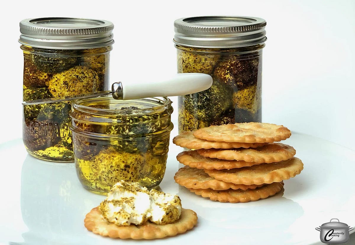 Fill olive oil in the container till all balls are fully dipped into oil