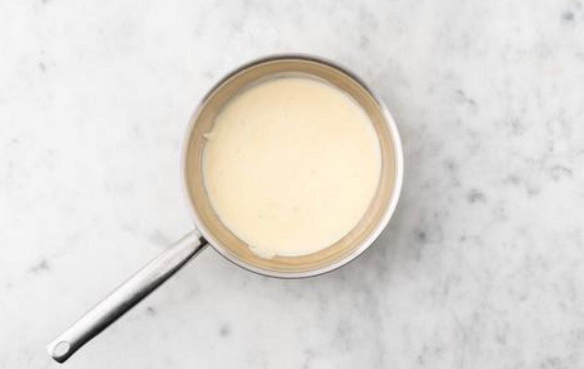 Once the potatoes are cooked, carefully drain in a
colander. Wipe out the (now empty) saucepan and return to
medium heat with a drizzle of oil. Once hot, add the remaining garlic and cook until fragrant, 30 secs Stir in the creme fraiche, chicken stock paste and water for the sauce (see pantry for amount). Mix together, bring to the boil, then remove from the heat. Season to taste with salt and pepper.