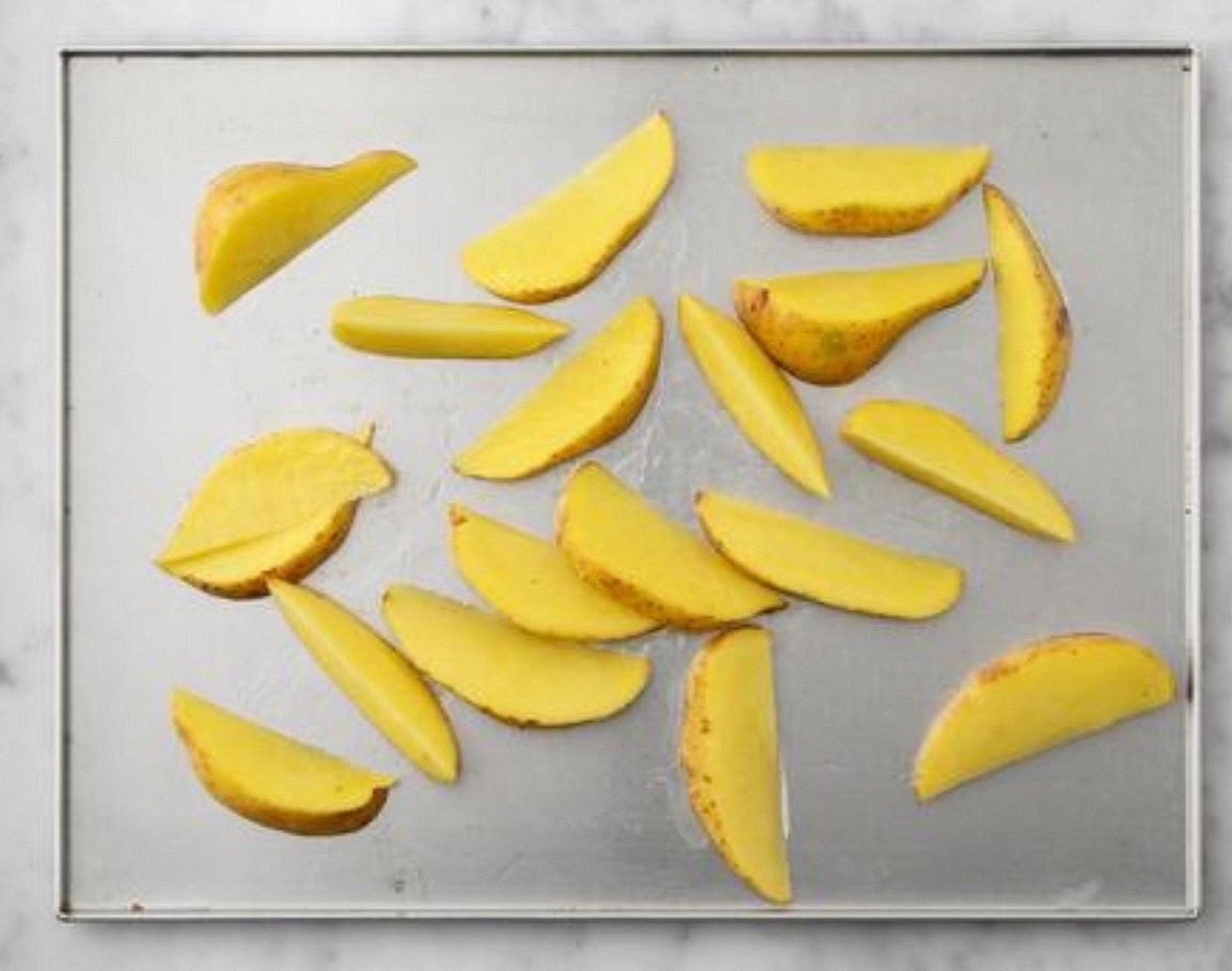 Preheat your oven to 220°C/200°C fan/gas mark 7. Chop the potatoes into 2cm wide wedges (no need to peel). Pop the wedges onto a large baking tray. Drizzle with oil, season with salt and pepper, then toss to coat. Spread out in a single layer. TIP: Use two baking trays if necessary. When the oven is hot, roast on the top shelf until golden, 25 - 35 mins. Turn halfway through.