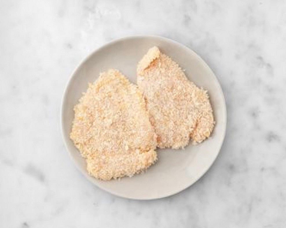 When the potatoes have 10 mins remaining, add the lardons to the tray. Pop into the oven and roast until golden, 8-10 mins. IMPORTANT: Wash your hands and equipment a er handling raw meat. Cook bacon
thoroughly. Dip the chicken into the egg and then the breadcrumbs, ensuring it's completely coated.