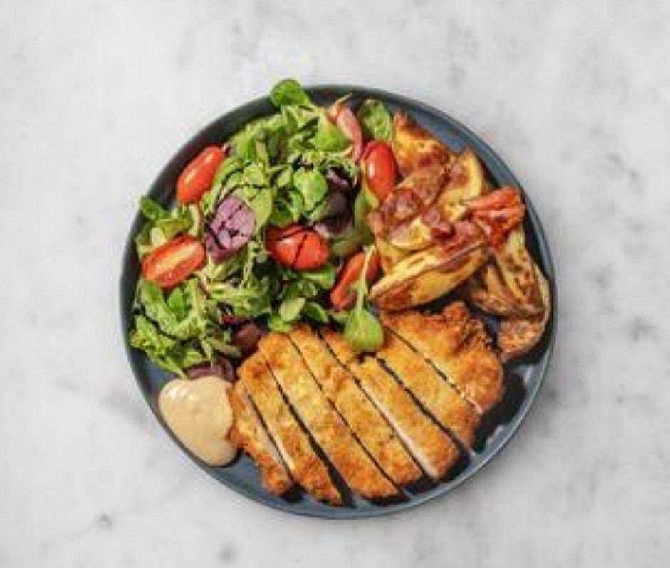 When ready, share the schnitzels and bacon wedges between your plates. Serve the baby leaf salad alongside, topped with the tomatoes and finished with a drizzle of balsamic glaze. Finish with a dollop of burger sauce on the side for dipping.