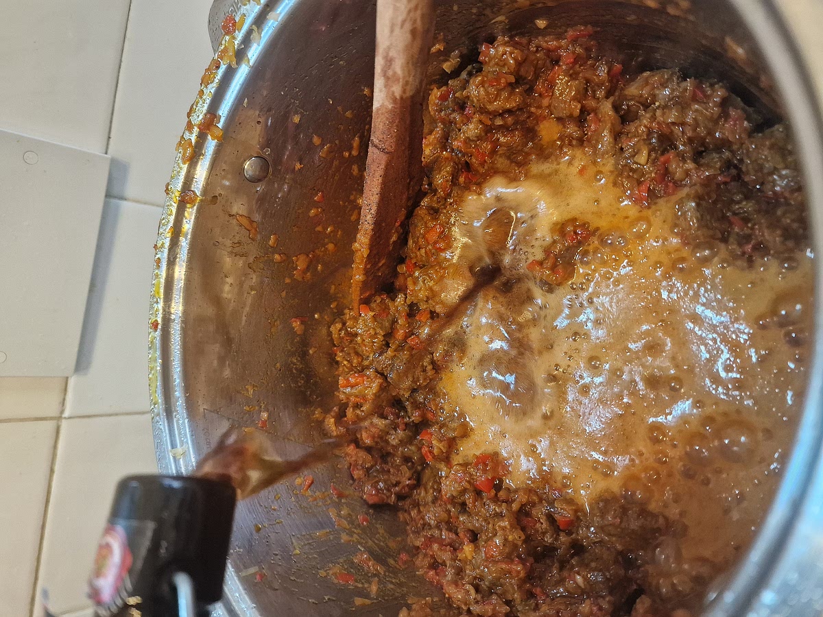 Finally you can add all the seared meat and stir everything properly. Now you can add a bit more salt and black pepper. Right after that you can add your dark beer and crank up the heat. Let it boil for at least 5 minutes to cook off the alcohol from the beer. (you can use red wine instead of dark beer, it's a different version of the same dish, I do this sometimes if I'm craving a bit of variety. This dish will still work very well with red wine, make sure to use a more robust one)