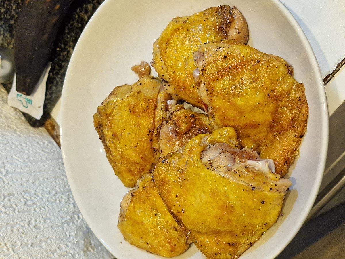 Dice your onion and set it aside. You don't need to dice your peppers just yet, there will be plenty of time to do that later. Take your meat out of the fridge, get a large, deep pot and heat it up. Melt animal fat and sear the meat in it. Quick sear until the skin is golden. Make sure not to burn the fat.