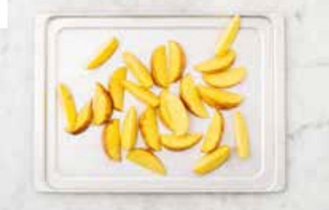 Preheat your oven to 220°C/200°C fan/gas mark 7. Chop the potatoes into 2cm wide wedges (no need to peel). Pop onto a large baking tray. Drizzle with oil, season with salt and pepper then toss to coat.
Spread out in a single layer. TIP: Use two baking trays if necessary. When the oven is hot, roast on the top shelf until golden, 25-35 mins. Turn halfway through.