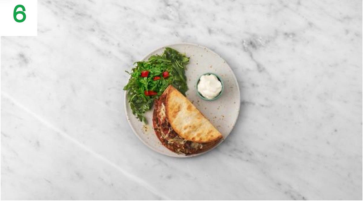 a) Once ready, transfer the quesadillas to your plates. b) Add the rocket to the tomato bowl, toss to coat and serve alongside the quesadillas. c) Serve the mayo (see pantry for amount) alongside for dipping.